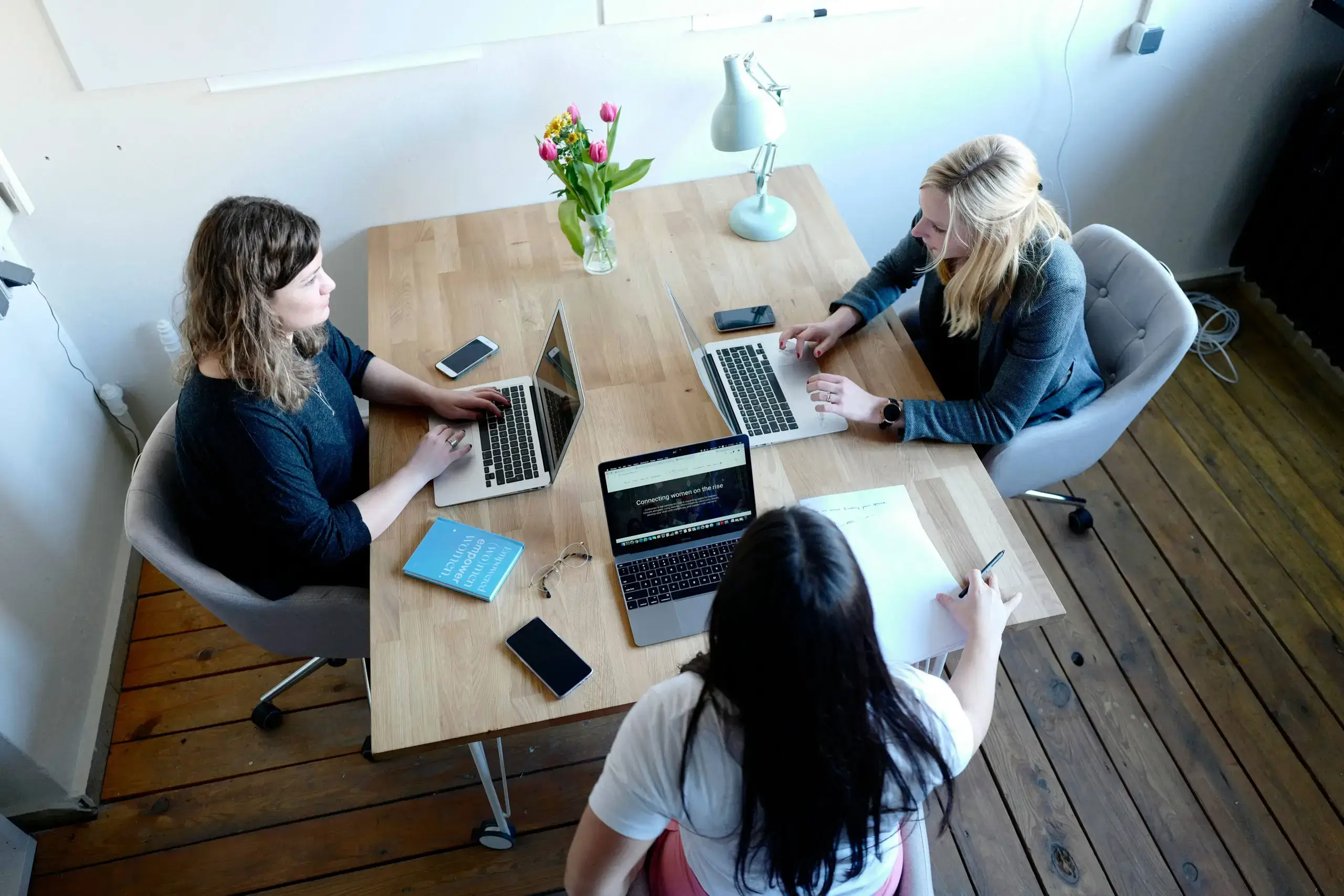 women_working_laptop_table